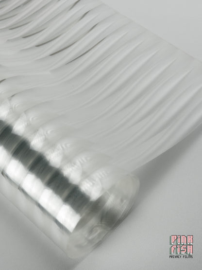 Roll of reeded glass window film on white background with Pink Fish Privacy Films branding