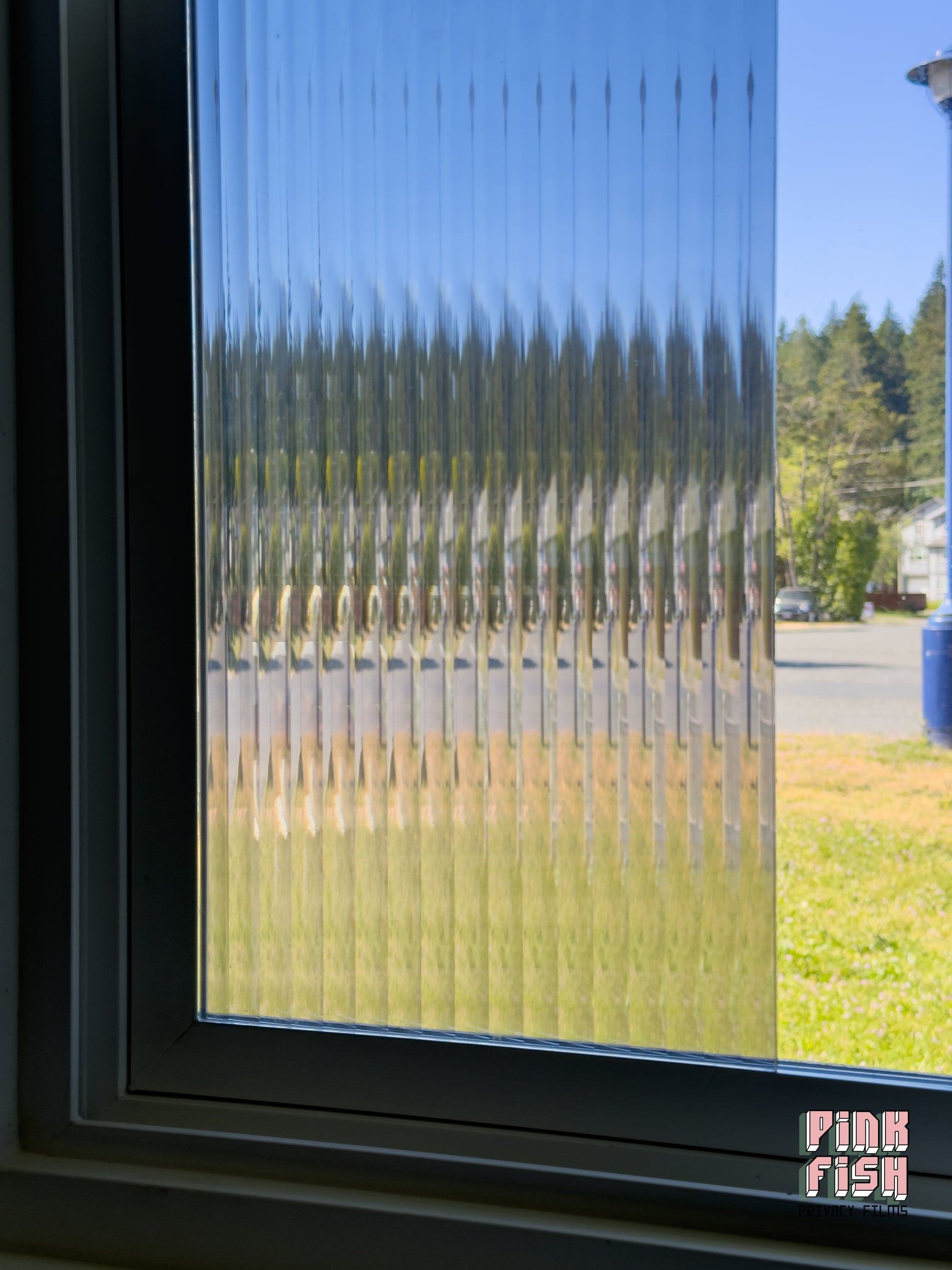 Window with decorative film showing a blurred outdoor scene