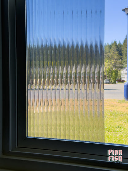 Window with decorative film showing a blurred outdoor scene
